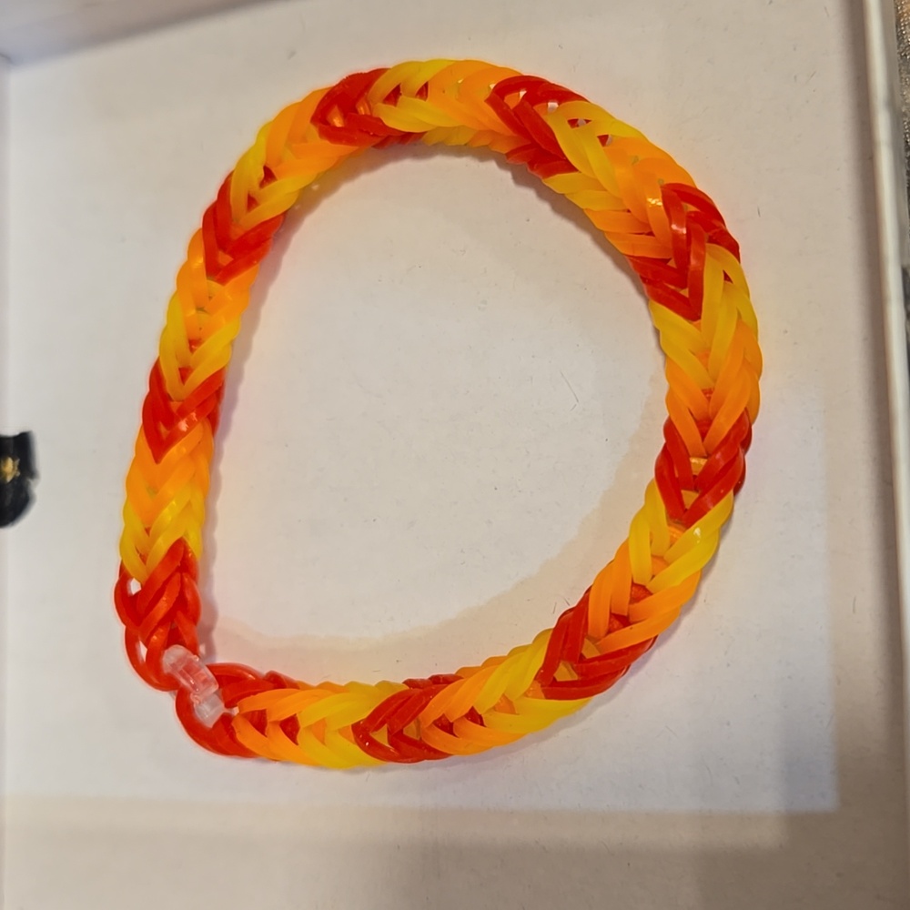 Handmade rubber band type bracelet. Very pretty colors.